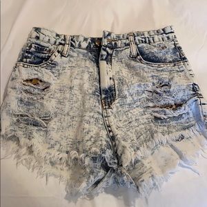 Light wash jean shorts with cheetah pockets